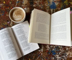 Books opened for reading accompanied with coffee