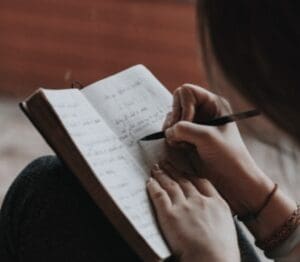 An woman is making important notes on a copy