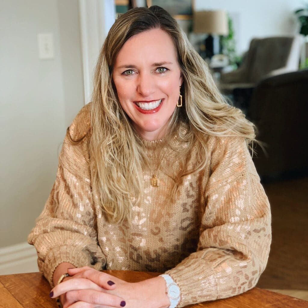 Smiling woman in a cozy living room.